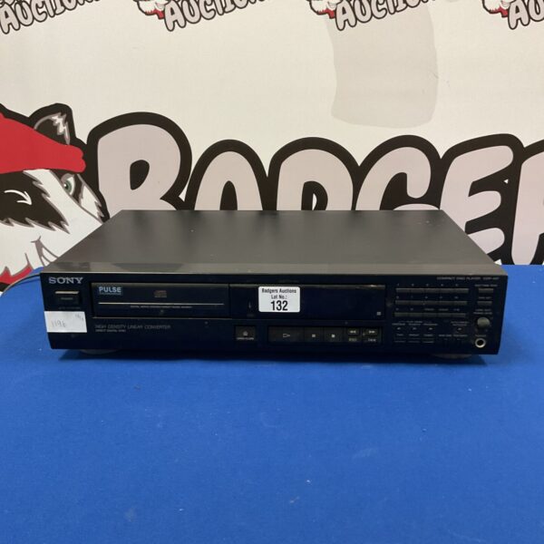 Black Sony CDP-497 CD player with front panel controls.