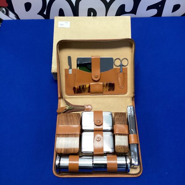 Vintage leather mens grooming kit with stainless steel tools.