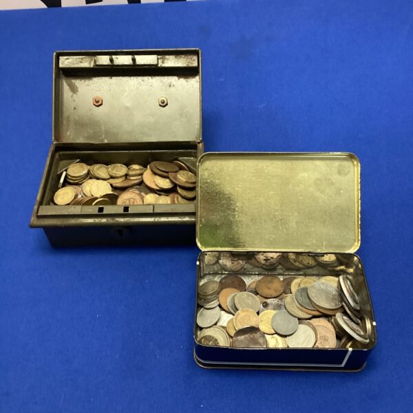 Assorted coin lot in two metal tins, vintage currency.