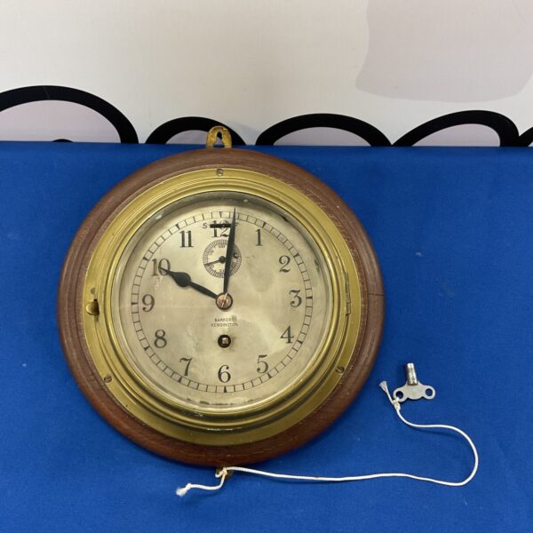 Antique Barker Kensington brass ships clock with key.
