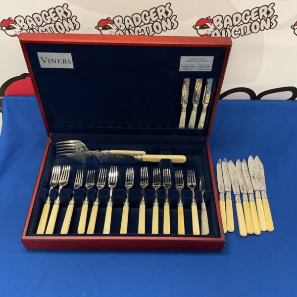 Vintage silver plate cutlery set with bone handles in a case.