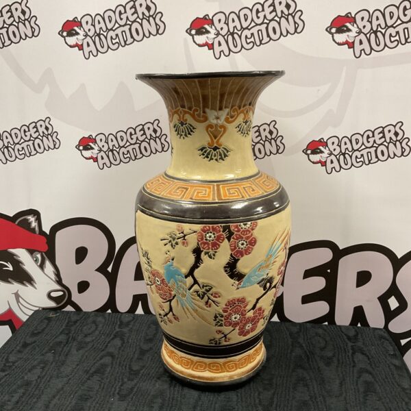 Large oriental bird pattern porcelain vase for display.