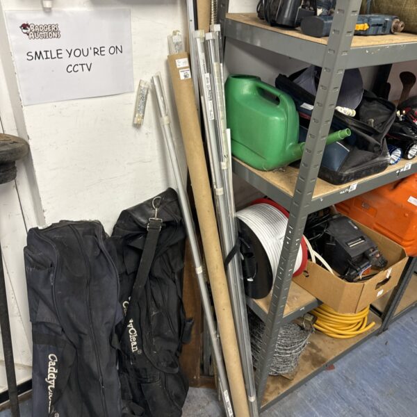 Selection of metal curtain rails and components in a cluttered space.