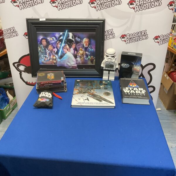 Star Wars mixed lot including DVDs, framed art, and alarm clock.