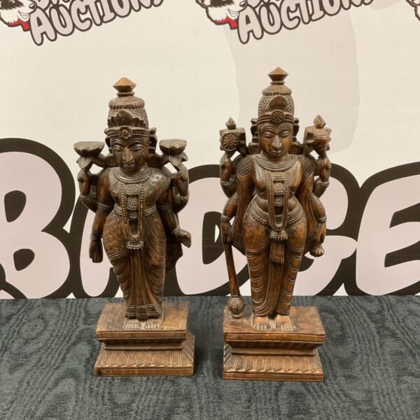 Pair of vintage carved wooden Indian Vishnu statues.