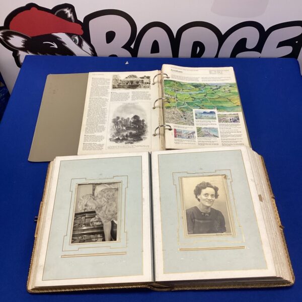Vintage photo album with AA road map page, travel ephemera.