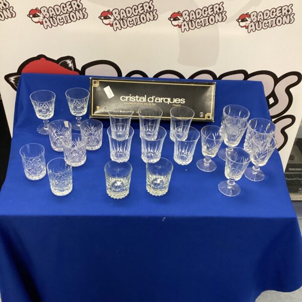 Selection of elegant Cristal D’Arques crystal glasses on display.