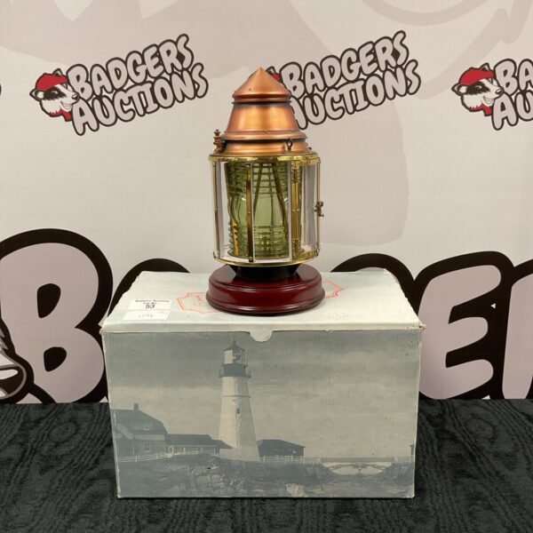 Vintage Harbour Lights lighthouse table lamp with clear glass lens.