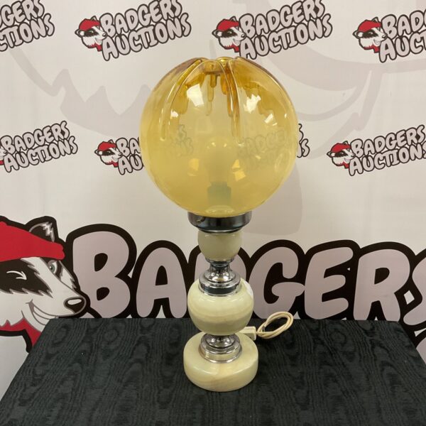 Vintage marble table lamp with yellow glass shade.