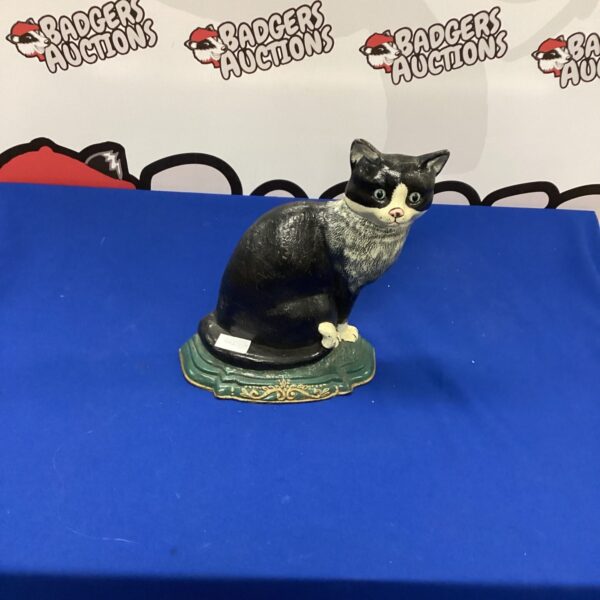 Vintage black cast iron cat doorstop for home decor.