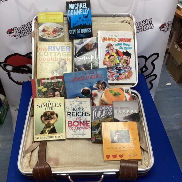 Mixed book lot with vintage cookbooks inside a suitcase.