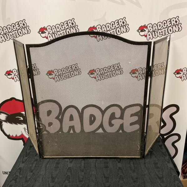 Vintage steel mesh tri-fold fire screen for fireplace safety.