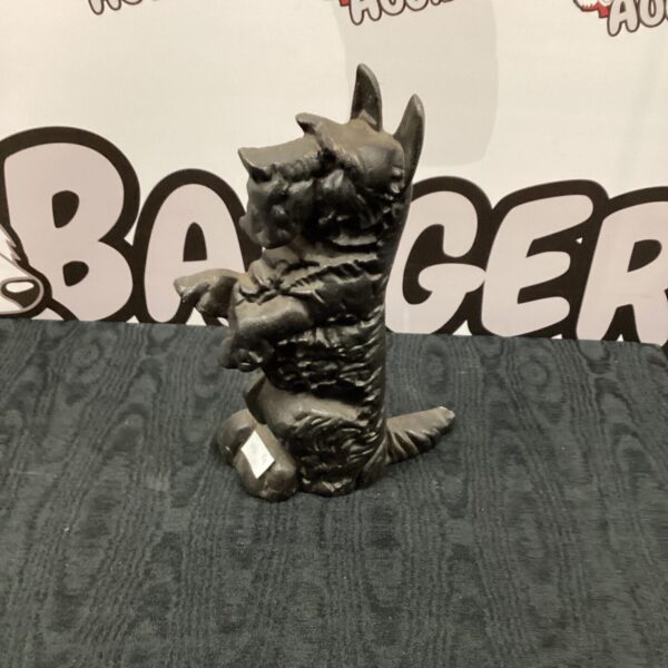 Vintage cast iron Scottie dog door stop for home decor.