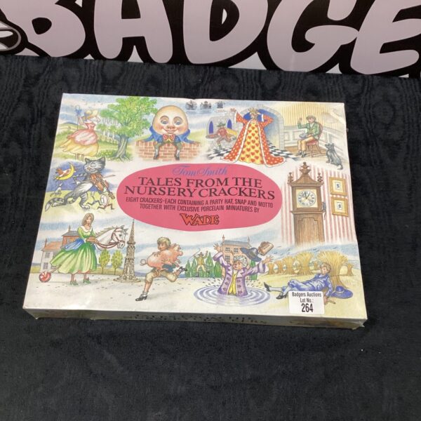 Box of vintage Wade Nursery Christmas crackers with porcelain figurines.