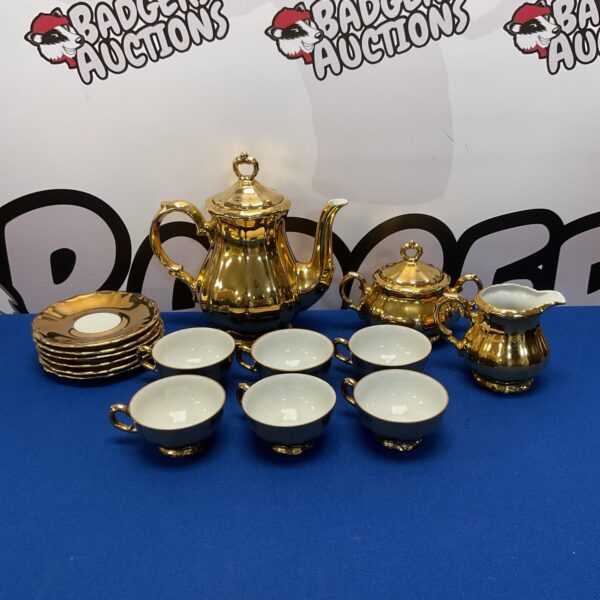 Gold Bavarian porcelain teaset with cups and saucers.