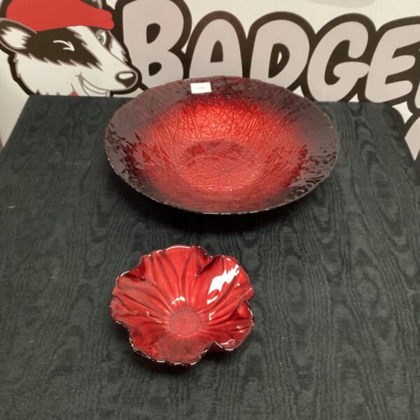 Vibrant red art glass bowl with undulating edges.