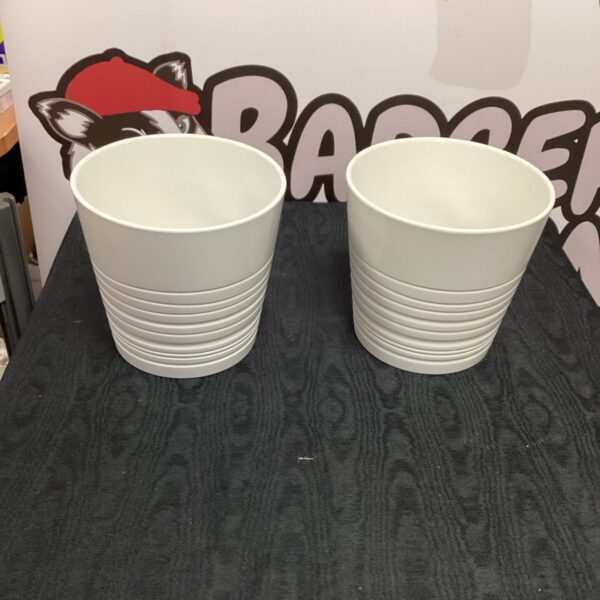 Pair of white flower pots for garden or home use.