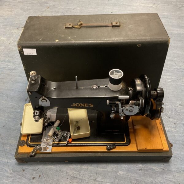 Vintage Jones hand crank sewing machine, antique collectible.