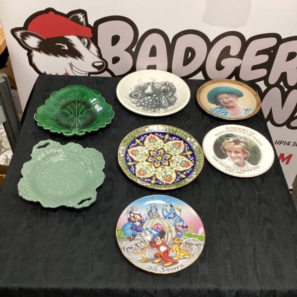 Selection of decorative collectors plates with varied designs and patterns.