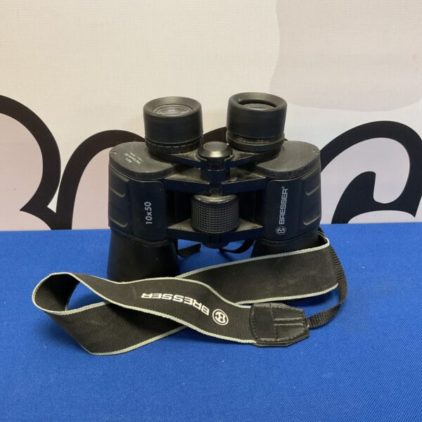 Vintage Bresser 10x50 binoculars with neck strap.