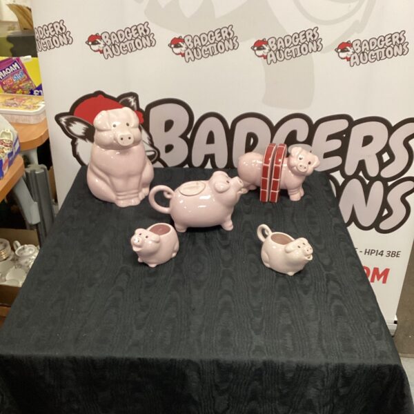 Vintage piglet porcelain tea set with teapot and cups.
