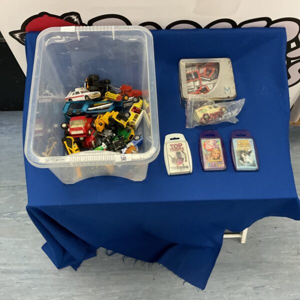 Mixed lot of diecast vehicles and Top Trumps cards for collectors.