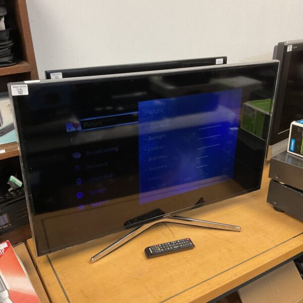 Used Samsung 40 inch smart TV with remote control displayed.