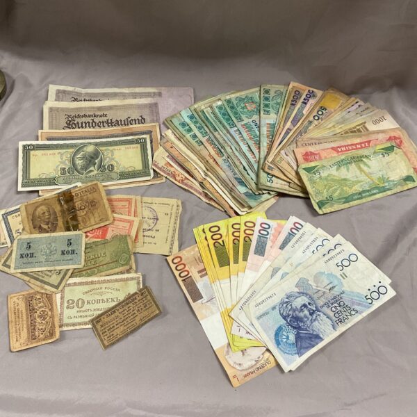 Assorted foreign banknotes and world currency collection for collectors.