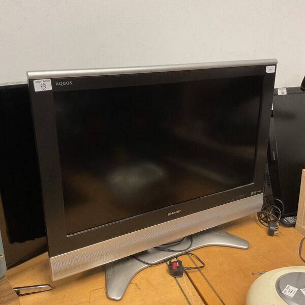 Silver Sharp Aquos 32 inch LCD television for sale.