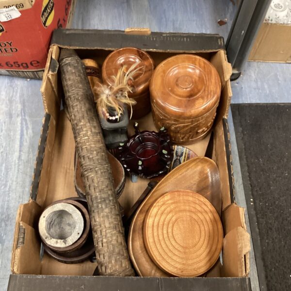 Selection of hand-carved wooden jars for rustic storage.
