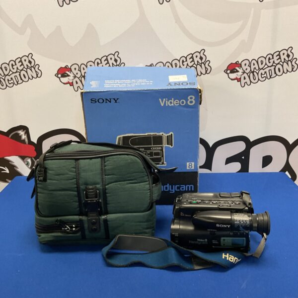Vintage Sony CCD-TR105E 8mm camcorder in a green case.