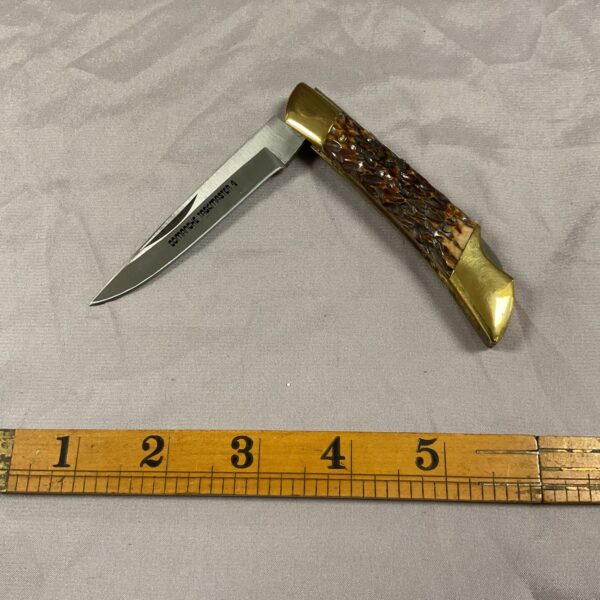 Vintage Comanche Taskmaster 4 pocket knife with horn handle.