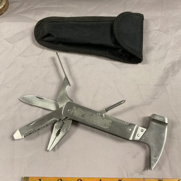 Vintage multi tool with carrying case, folding pocket knife.