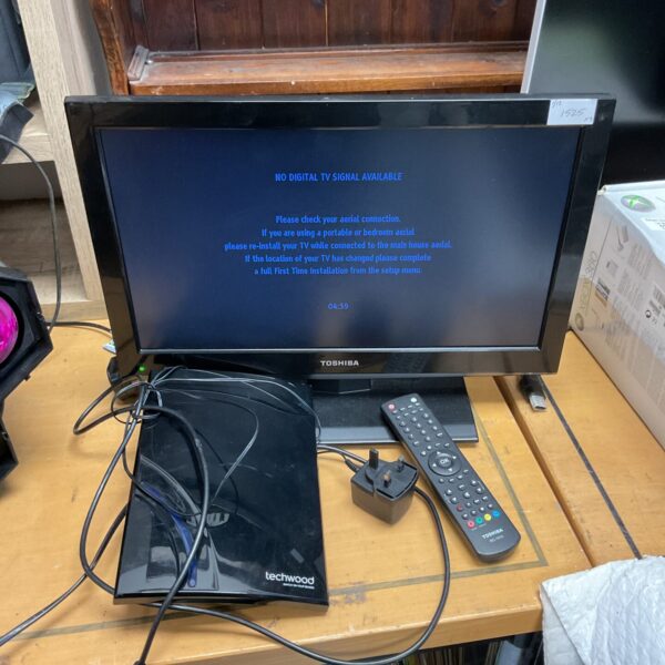 Toshiba 19 inch HD television with remote and TV box.