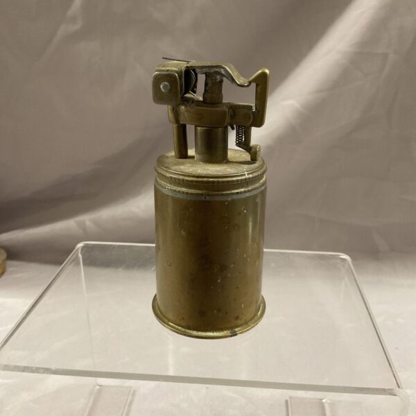Vintage 1942 trench art lighter made from a two-pounder shell.