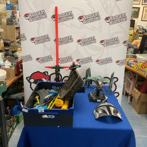 Mixed Star Wars toy lot with lightsaber and train set.