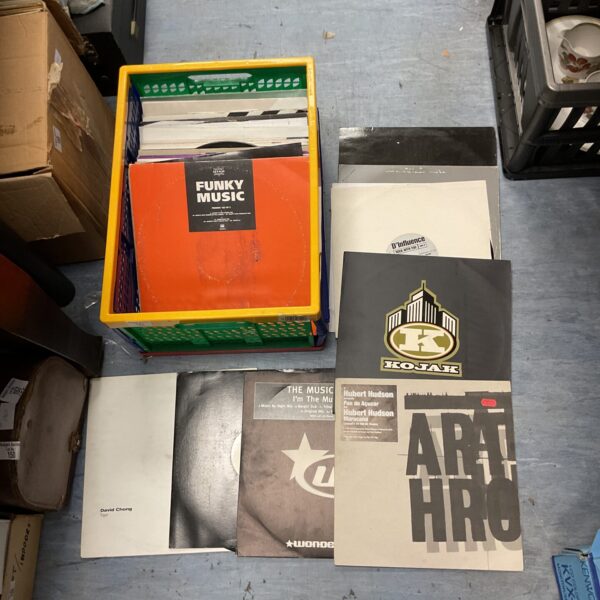 Lot of vintage dance music vinyl records in a crate.