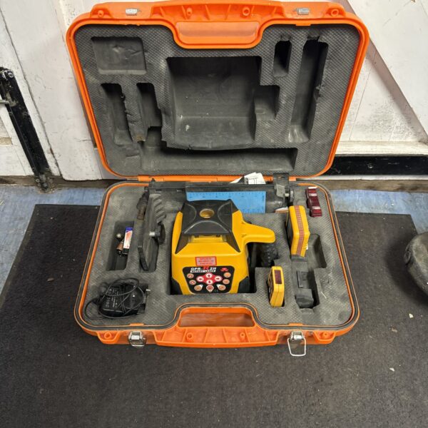 Orange carrying case containing a rotary laser level and accessories.