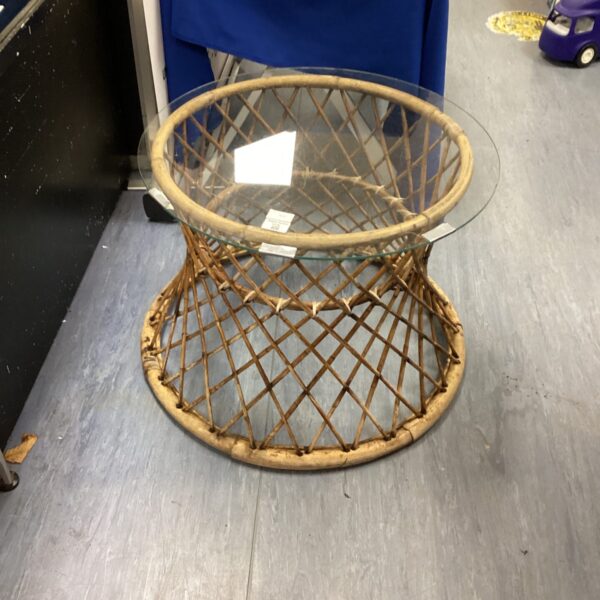 Vintage wicker glass table with round glass top.