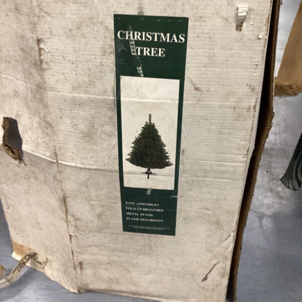 Artificial Christmas tree in original packaging, ready for the holidays.