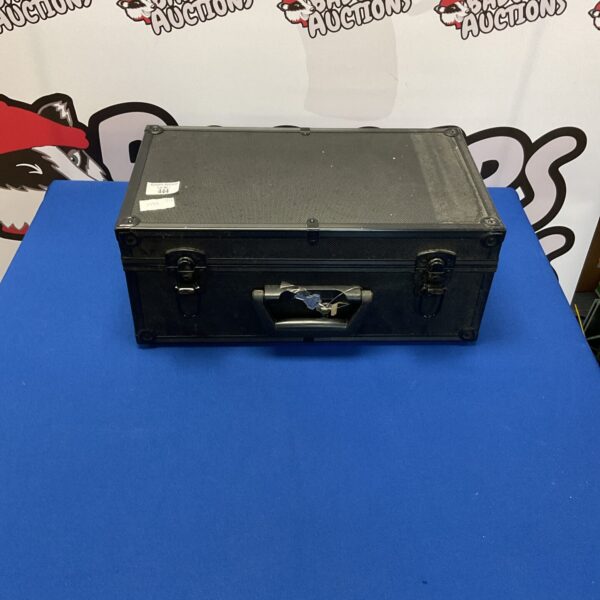 Black lockable storage case with keys, front view.