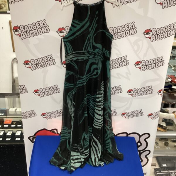 Elegant full-length black party dress with a unique pattern.