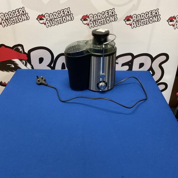 White and silver Puremate juice maker on a countertop.