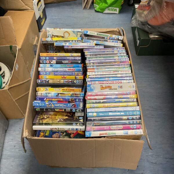 Large collection of Disney and children's DVDs in a cardboard box.