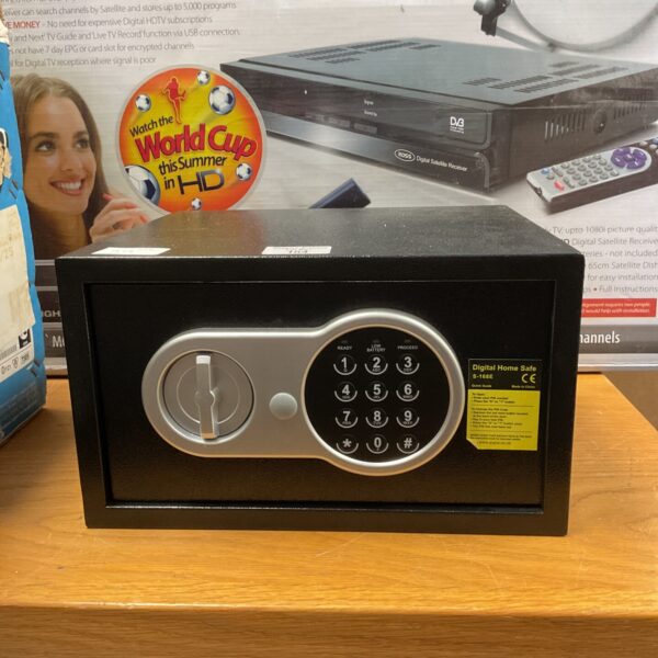 Front view of a digital home safe with key and code access.