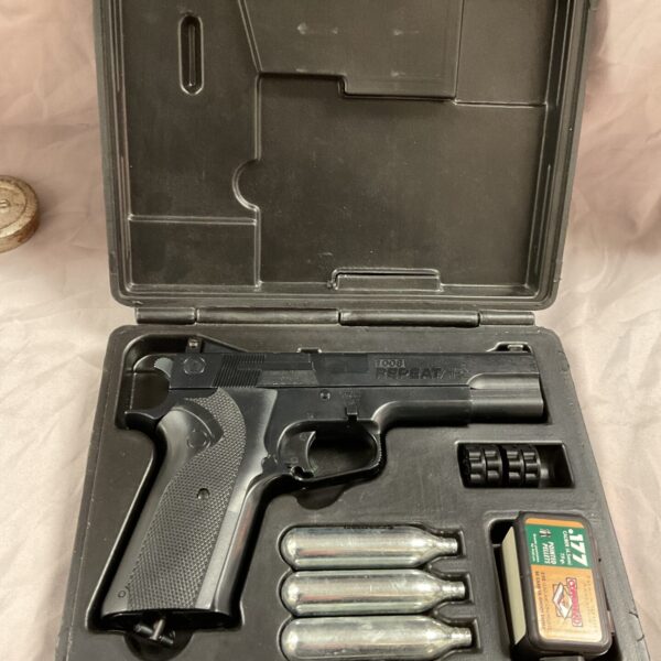 Vintage Crossman 1008 air pistol in its original case.