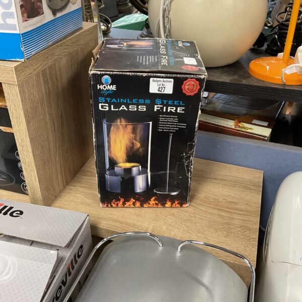 Stainless steel glass fire decorative tabletop fireplace.