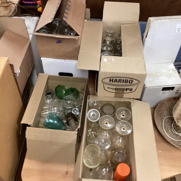 Large lot of assorted drinking glasses for beverages.