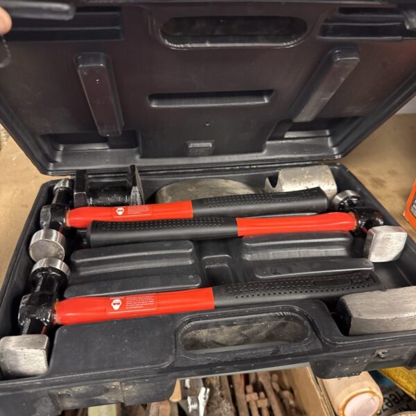 Amtech panel beating tool kit with hammers and shaping tools.