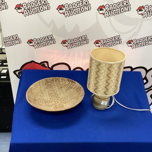 Handmade pottery table lamp with textured ceramic base.